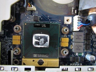 [ Arctic Silver Ceramique squeezed out from between CPU and heatsink contact surfaces ]