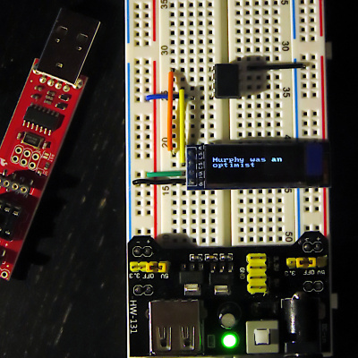 [Attiny95 driving a 128x32 I2C OLED screen on a breadboard]